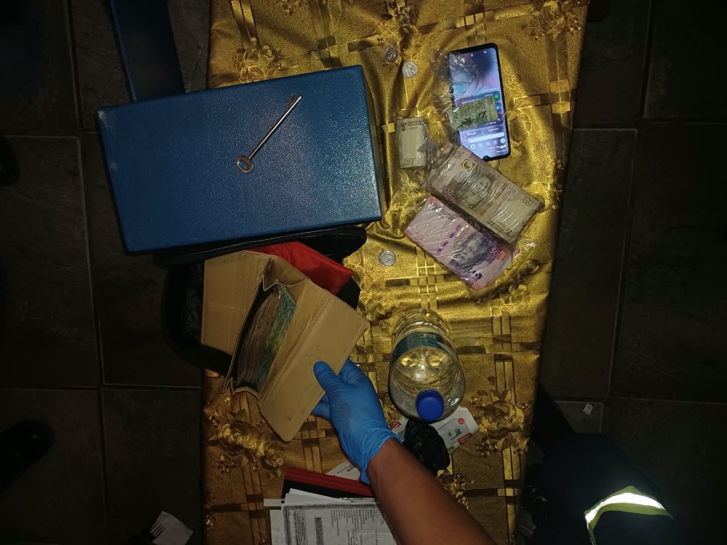 Two purses and an undisclosed amount of cash were also confiscated,