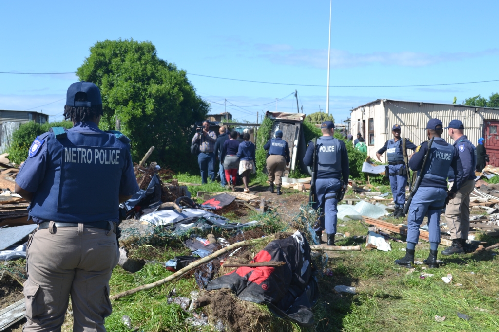 A large police presence was at the scene in Airport Valley, Gqeberha, where residents and their belongings were removed.