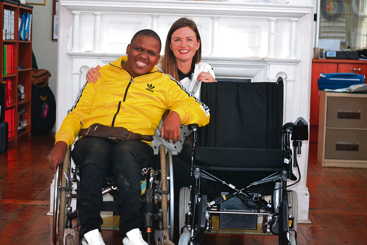 Sandile Msizi and Simone Jucker with his new motorised wheelchair.