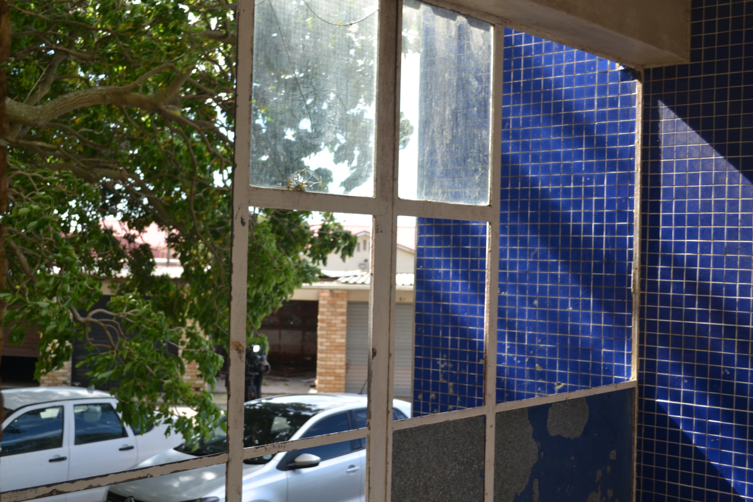 Broken windows at the Algoa Park police barracks in Gqeberha reflect the deteriorating condition of the accommodation.