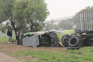 Trio of young children officially removed from pile of tyres their parents call home