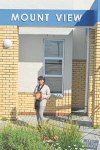 Author revisits high school, donates book