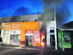 Slum building in Wynberg in flames a few days after being raided