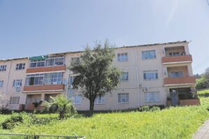 “It was just a two-second rumble, and the next minute the roof was gone,” recalls District Six resident
