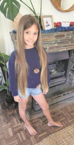 Young sisters donate their long, shiny locks to help cancer patients