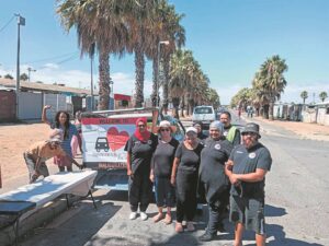 Kensington Scholar Transport hosts community outreach to Feed vulnerable people in factreton
