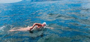 Amber-Rose swims into history books as the youngest female to finish False Bay crossing