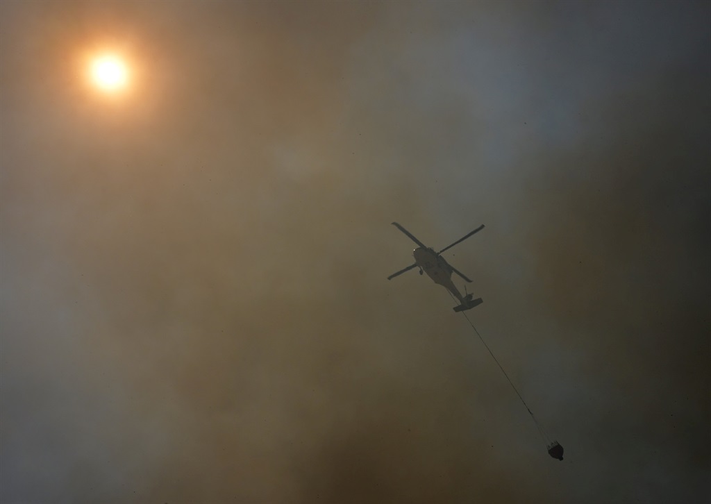 Amid flare-ups and knee-deep hot ash on the mounta