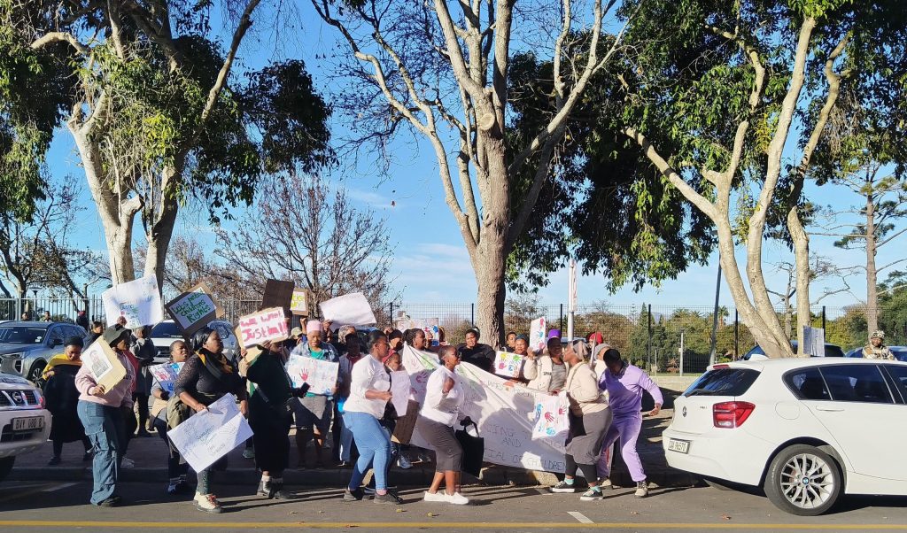 Residents staged a protest outside the court.