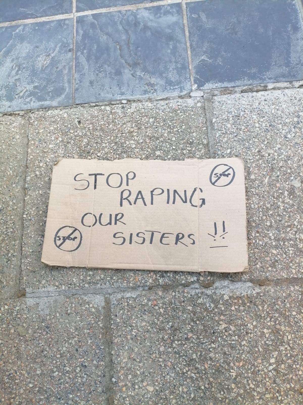 A placard at a protest sending a clear message to perpetrators. Photo: Kaylynne Bantom