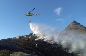Many crews, both land and aerial, battling spreading Simon’s Town fire