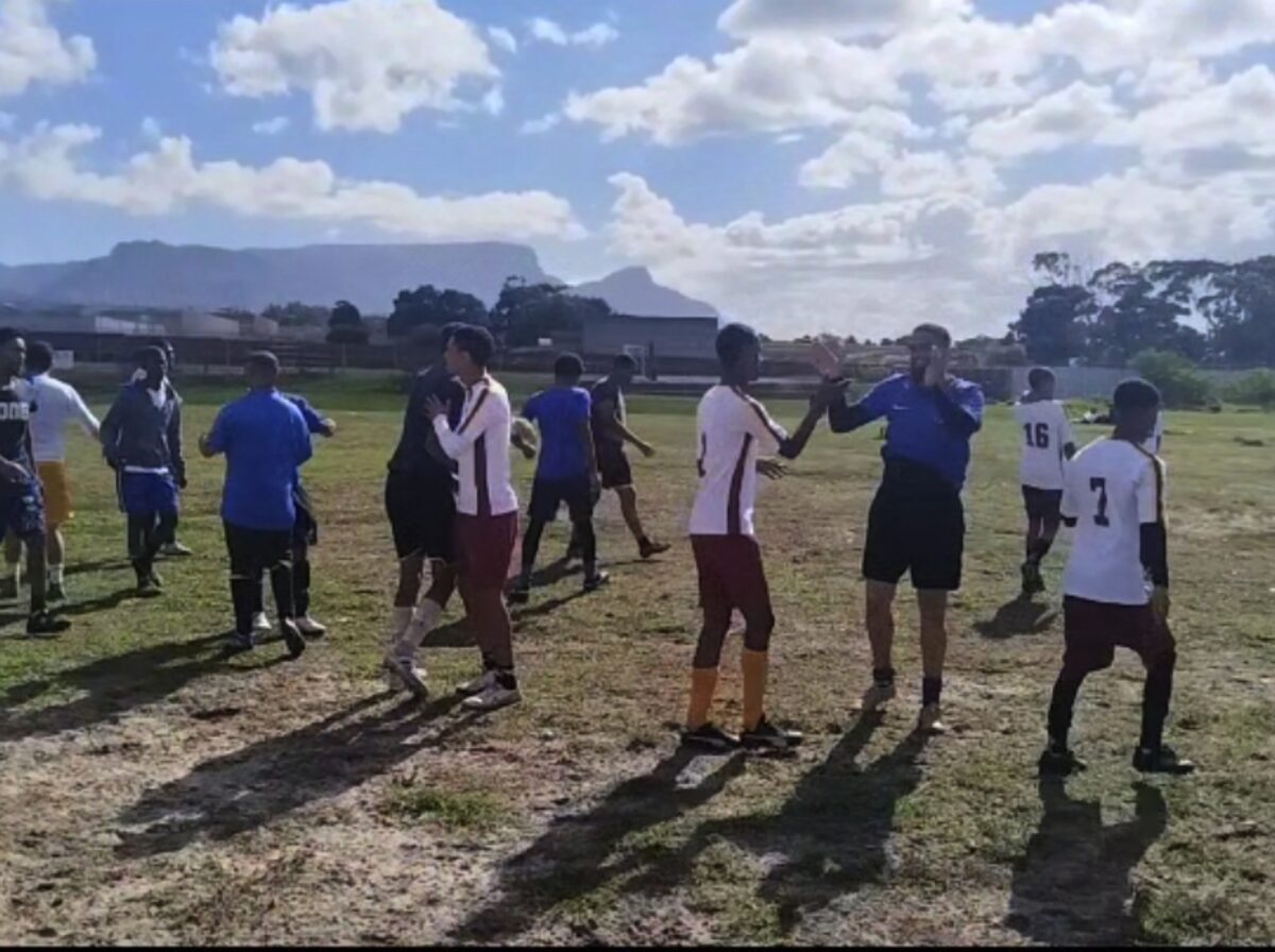 Players compete during the Westlake Freedom Day soccer tournament in wet weather as residents gather to support youth sport initiatives.