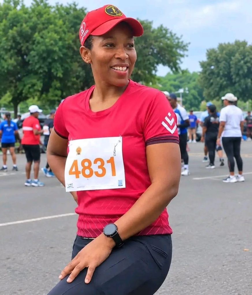 Elizabeth Moselakgomo, a woman in running clothes, smiles in a family photo. She was found dead in Kempton Park.