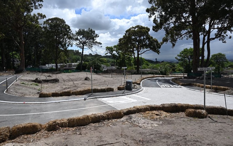 A newly paved road curves through the cleared Protea Village construction site in Bishopscourt