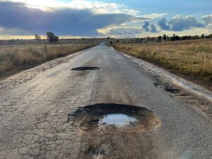 Pothole repair, resealing in process in Monte Vista, before work starts in Edgemead