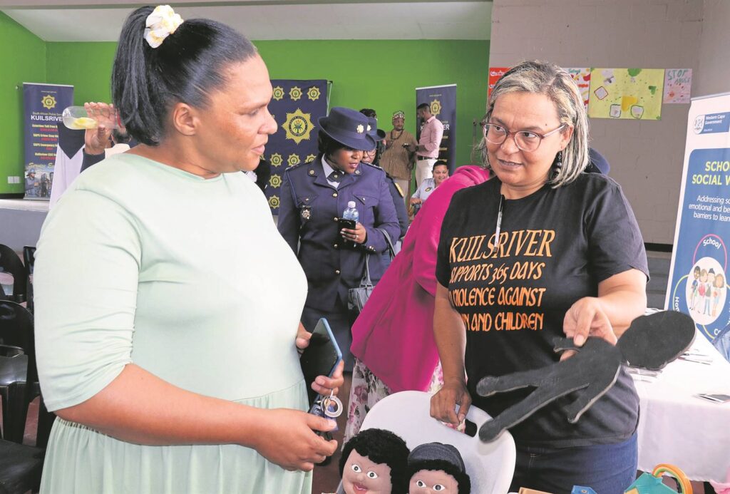 Lorraine Waterboer (social worker, education department) and Cpt Cecile Adams (Family Violence, Child Protection and Sexual Offences unit) with a doll used to help children verbalise abuse.