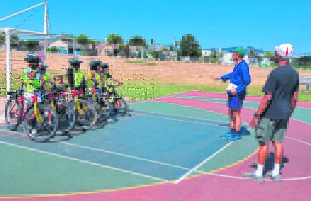 William Newman (right) and Winston Middleton with some of the yoingsters at the programme launch.