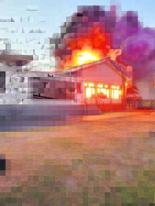 Fire threatens homes, animals