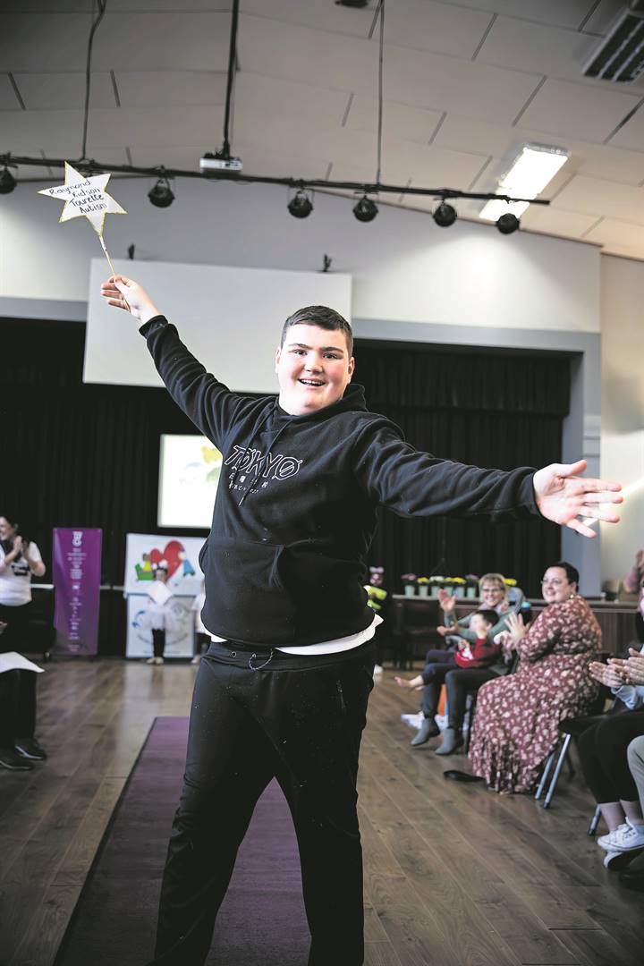 Raymond Kidson spreads his arms out and smiles