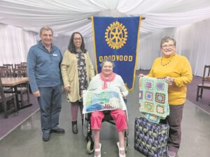 A donation of blankets to the Muscular Dystrophy Foundation warms body and soul