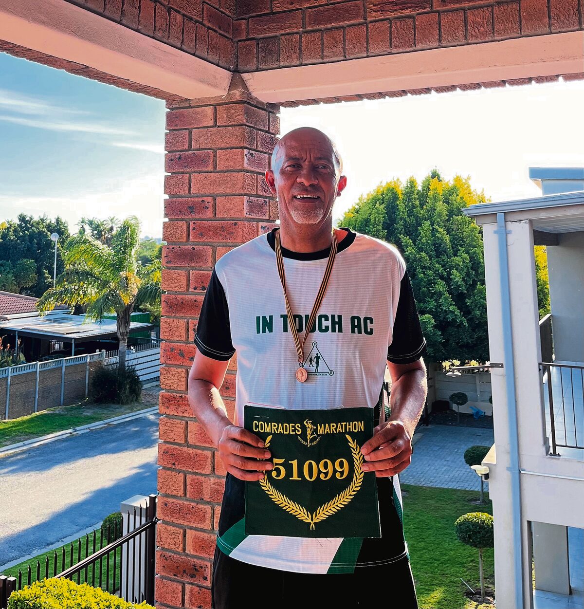 Pastor Philip Bosman with his Comrades green number.