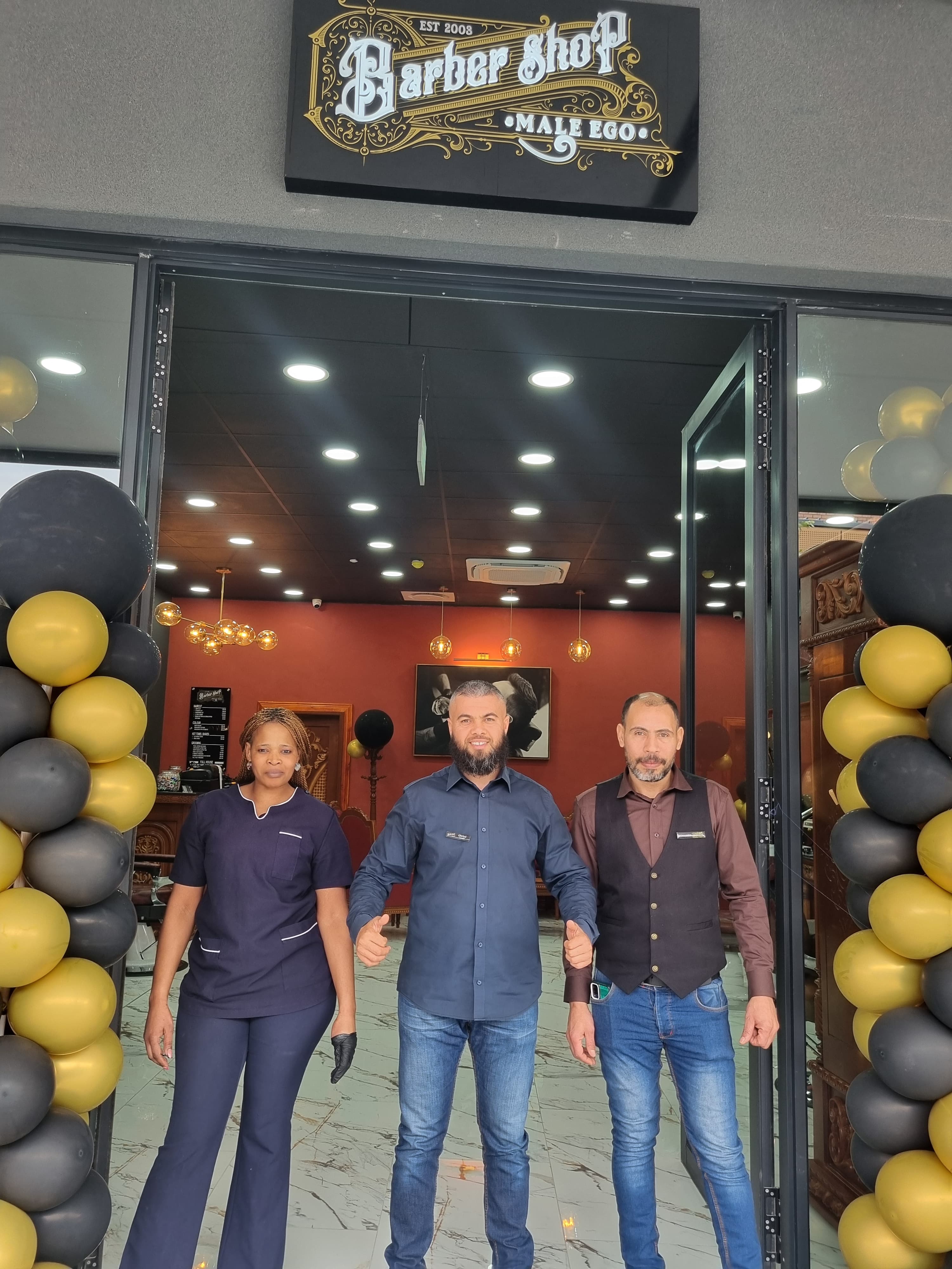 Mido Ghrissi (centre), owner, is with Asanda Nkungwana (left) and Homar Mohamed in the new barber shop for men.