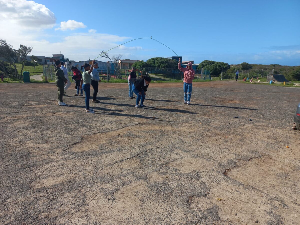 Children skip in the parking area of the YMCA Campsite in Strandfontein. The campsite hosted Advance Edokus volunteers who held a Back to School fun day with the children. The children played five-a-side soccer, did arts and crafts and listened to motivational talks.