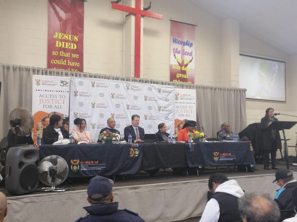 Deputy Minister of Justice and Constitutional Development, Andries Nel (centre), with a panel of representatives from various departments who addressed issues affecting seniors, at the Frog Centre in Woodlands.