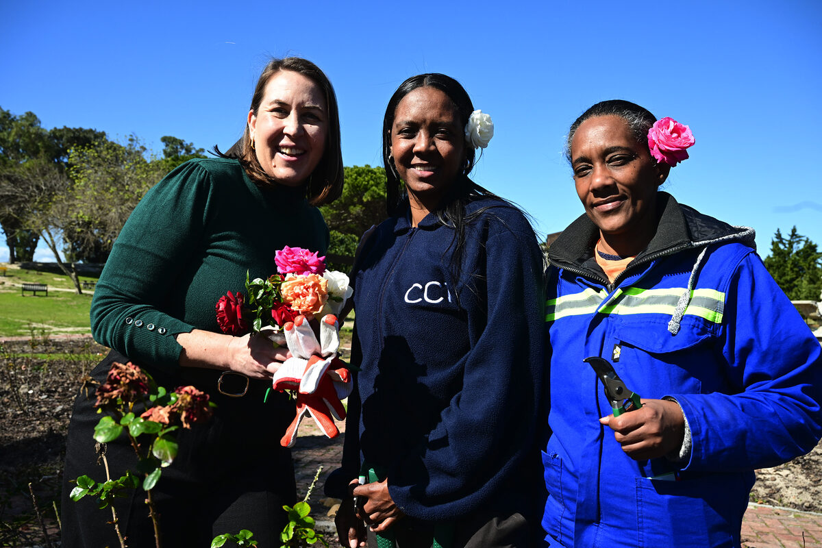 Councillor Higham is shown the finer art of pruning by Jamie Lee Martinus and Janine Carriem.