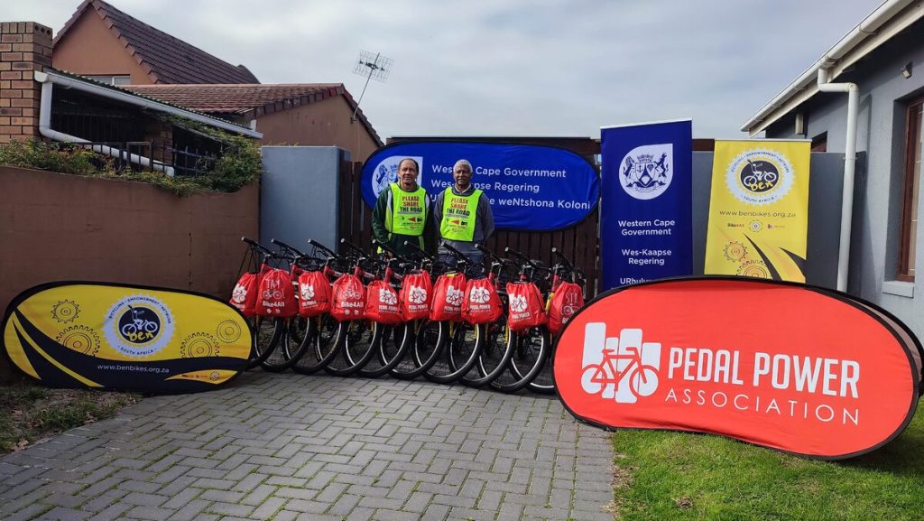 Photo of Winston Middleton and William Newman with the 10 bicycles donated by the Western Cape Mobility 