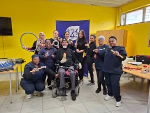 Team gets training wheels turning on wheelchair repair