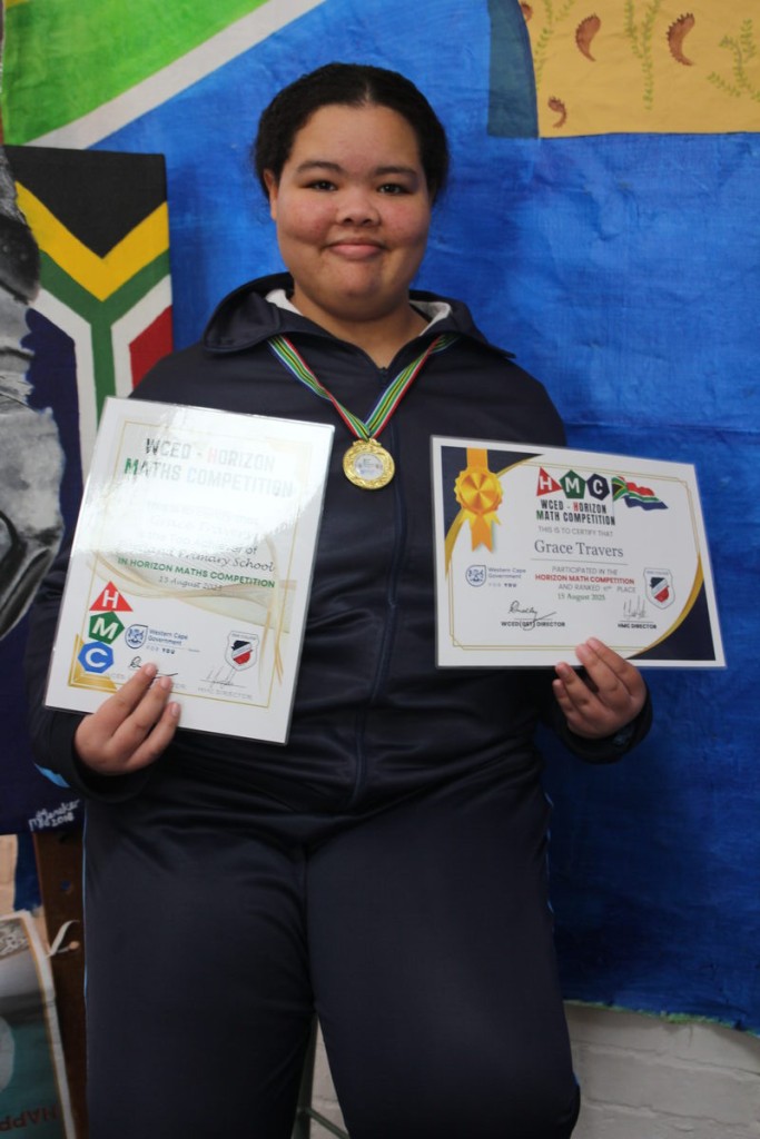 Grace Travers with her certificates and gold medal for achieving the best result out of all the Mitchell's Plain pupils who took part in the Western Cape Education Department's Horizon Maths Competition.