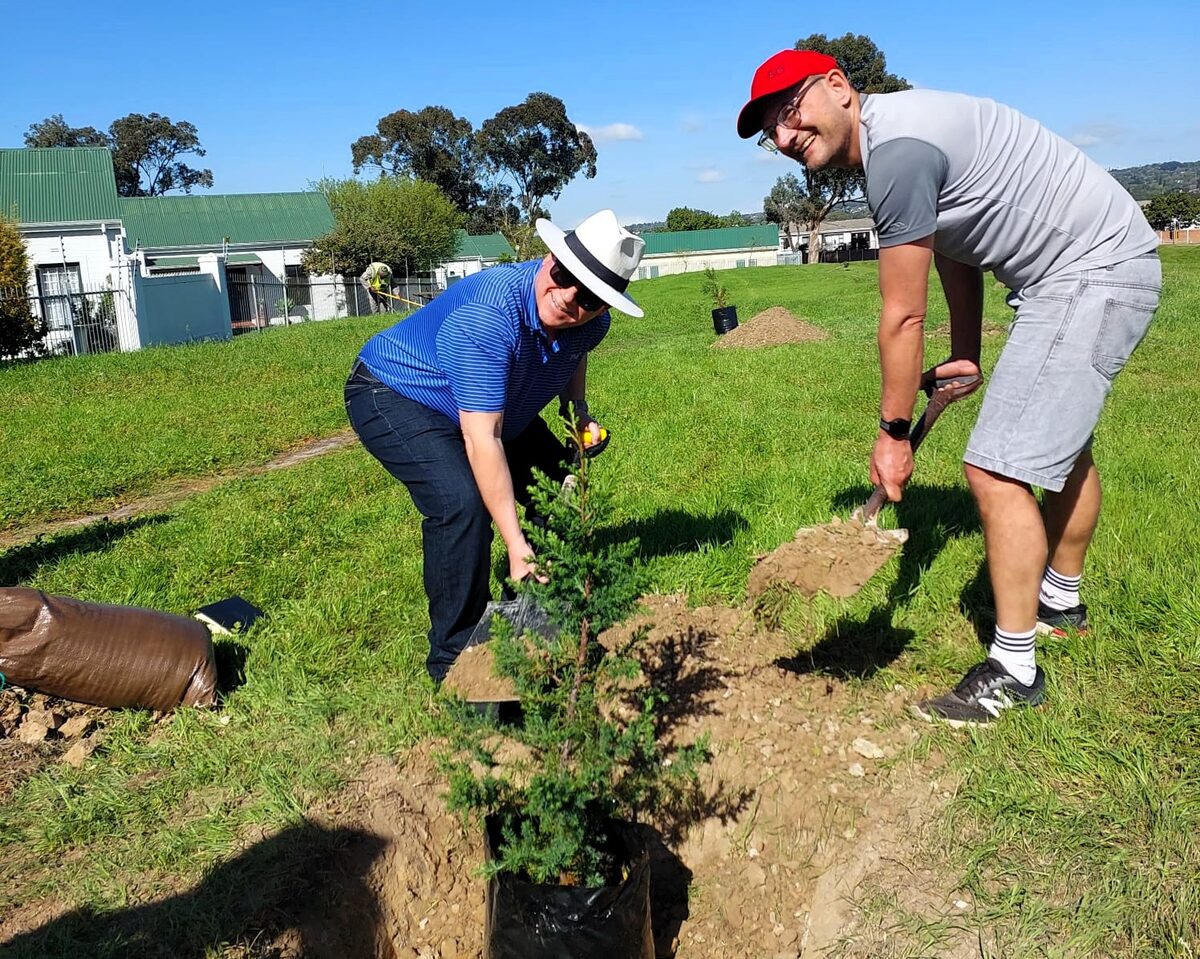 Gerhard Fourie, ward councillor and chair of Subcouncil 7, and David Howard putting their shoulders to the wheel. Photo: Cindy Green