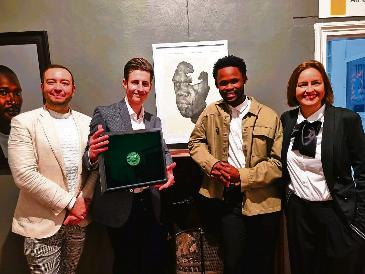 At the Rust-en-Vrede Portrait Award on Friday were (from left) Donavan Mynhardt (curator of Rust-en-Vrede Gallery), Ruan Huisamen from Durbanville (winner of the Ryno Swart Drawing Medal), Malik Mani from Upington (first prize winner of the Portrait Award) with his work in the background, and Hamlin Jansen van Vuuren (senior curator of Rust-en-Vrede Gallery).