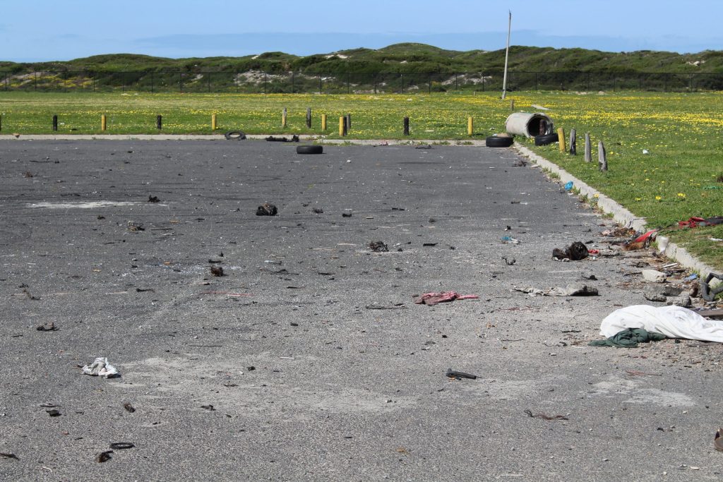 The Dolomites Sports Field parking area, is covered in popped tyres and litter following a illegal spinning event.