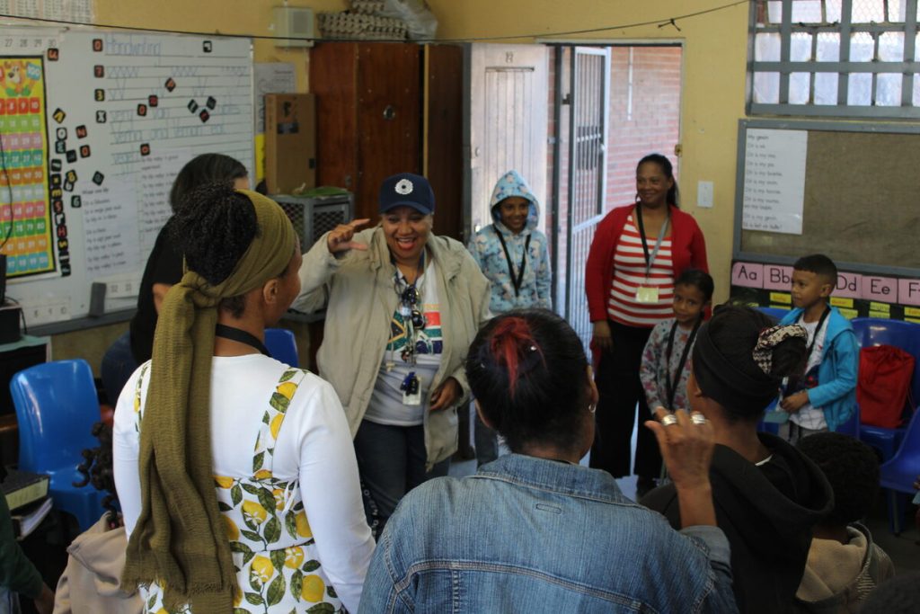 Children’s facilitator Mary-Ann Bergman does an icebreaker with Family Strengthening Programme participants at Cascade Primary School.