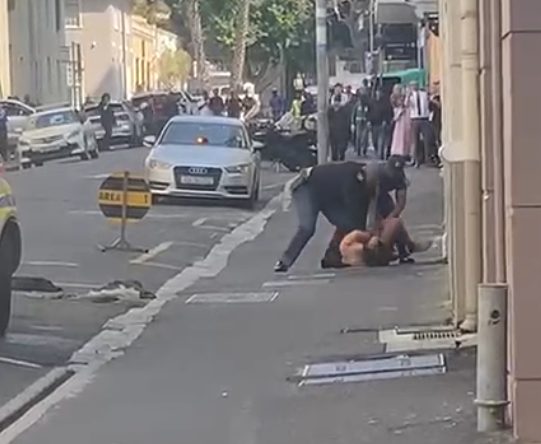 Police officers seen overpowering and arresting the suspect in a screengrab from one of the videos.