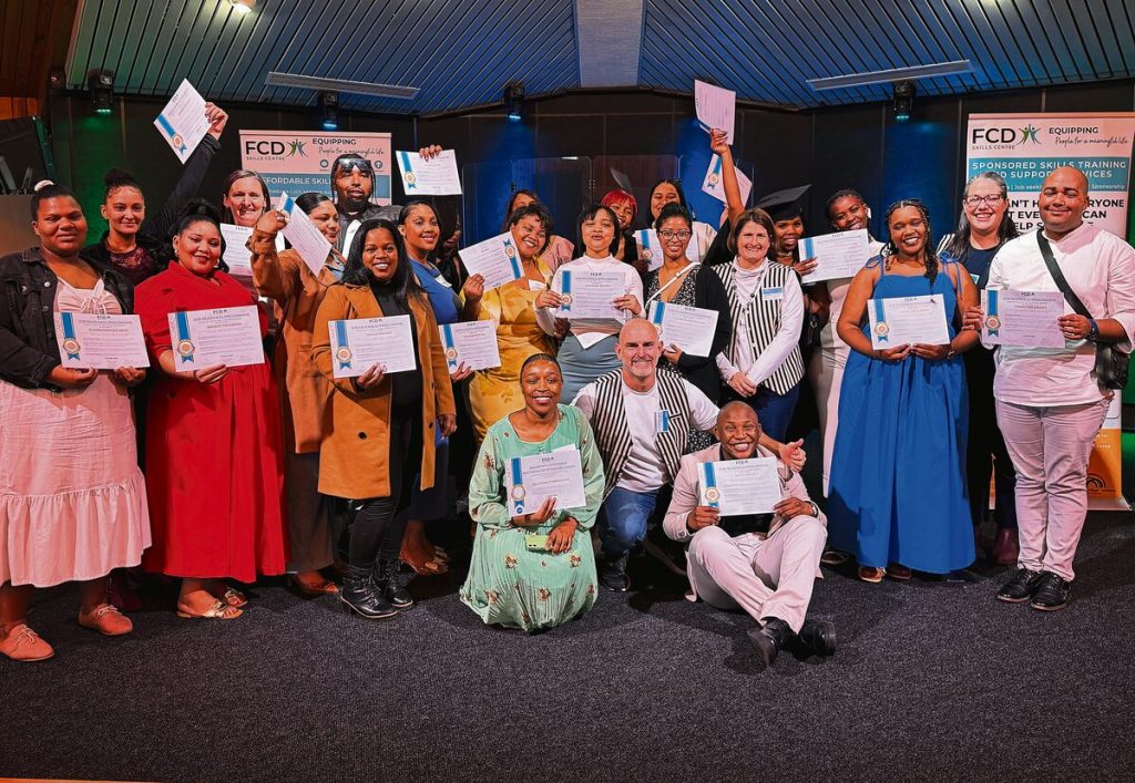 The Job Readiness group proudly hold their certificates after they graduated.