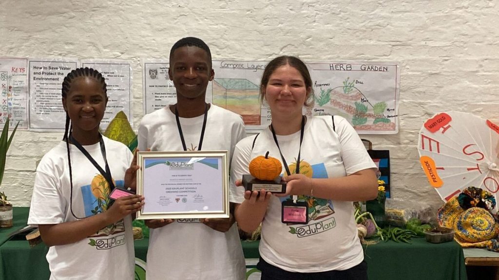 The team from Rouxville Primary School at the finals in Rustenburg with their provincial award, from left Avuyisile Memela, Neo Masego, and Zosia Witaszek.