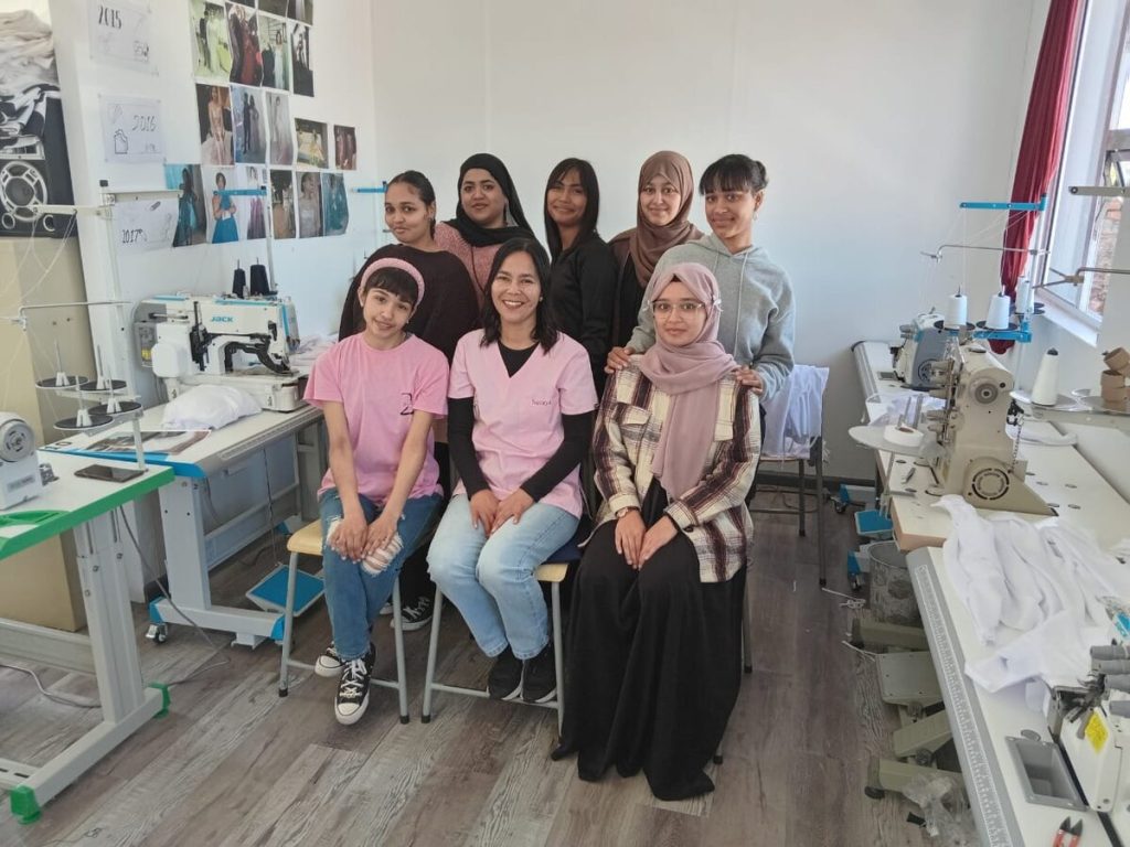 Suraya Williams is seated in the centre of her trainees and staff. They are, back from left, Rabia Jacobs, Momina Ajouhar, Qudisyyah Rabin, Ghusnaa Londt, La-eeqah Gill, Almaaz Abdullah and Khadeeja Londt.