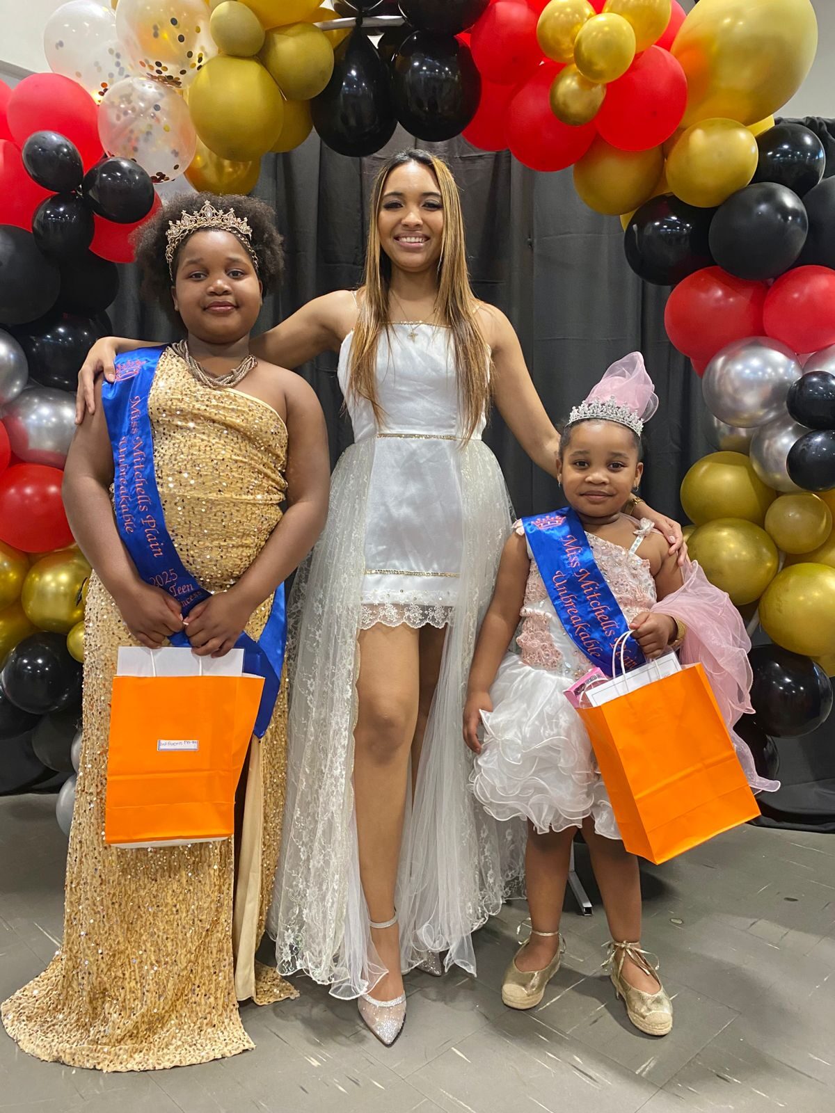 From left are second princess pre-teen Thandokazi Mhlalo, Kayla Jenecker and Little Miss Tiny First Princess Anesipho Mhlalo.