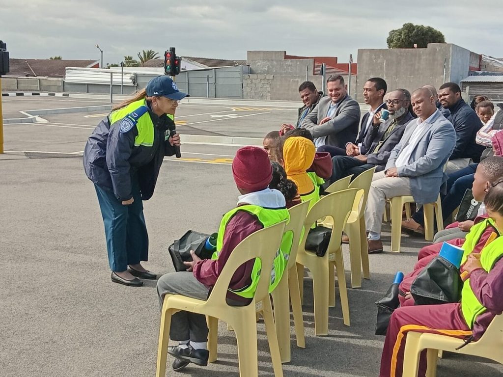 Senior traffic officer Anthea Daniels teaches the children how to cross the road safely.