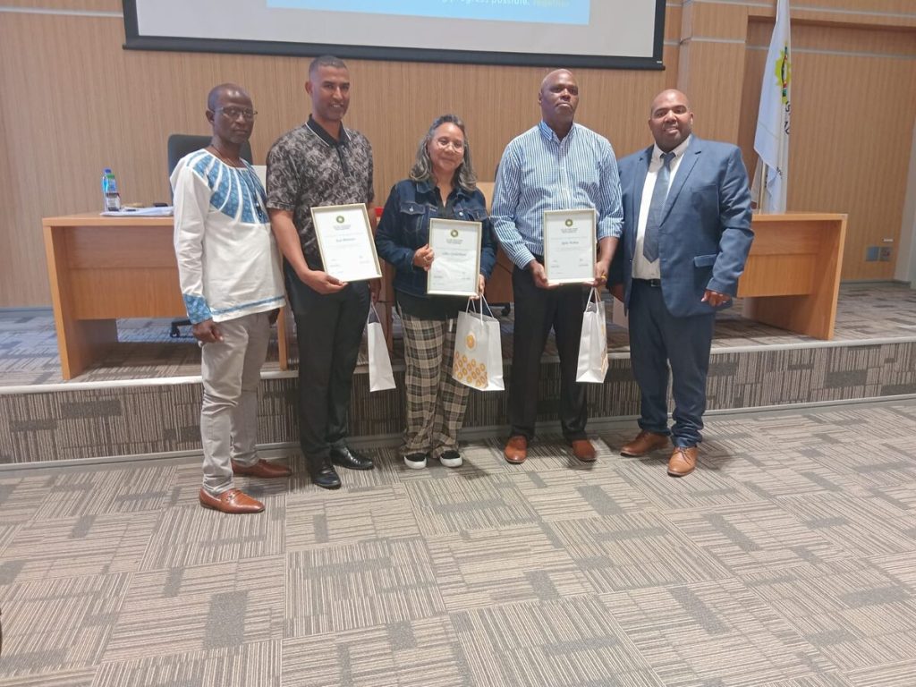 Sub-council 12 manager Mcebisi Fetu, on the far left, presented gifts to City officials, Jade Philander, Lilian Gerdebloem and Sipho Mabeka at the Sub-council 12 meeting last week. On the right is sub-council chair Solomon Philander.