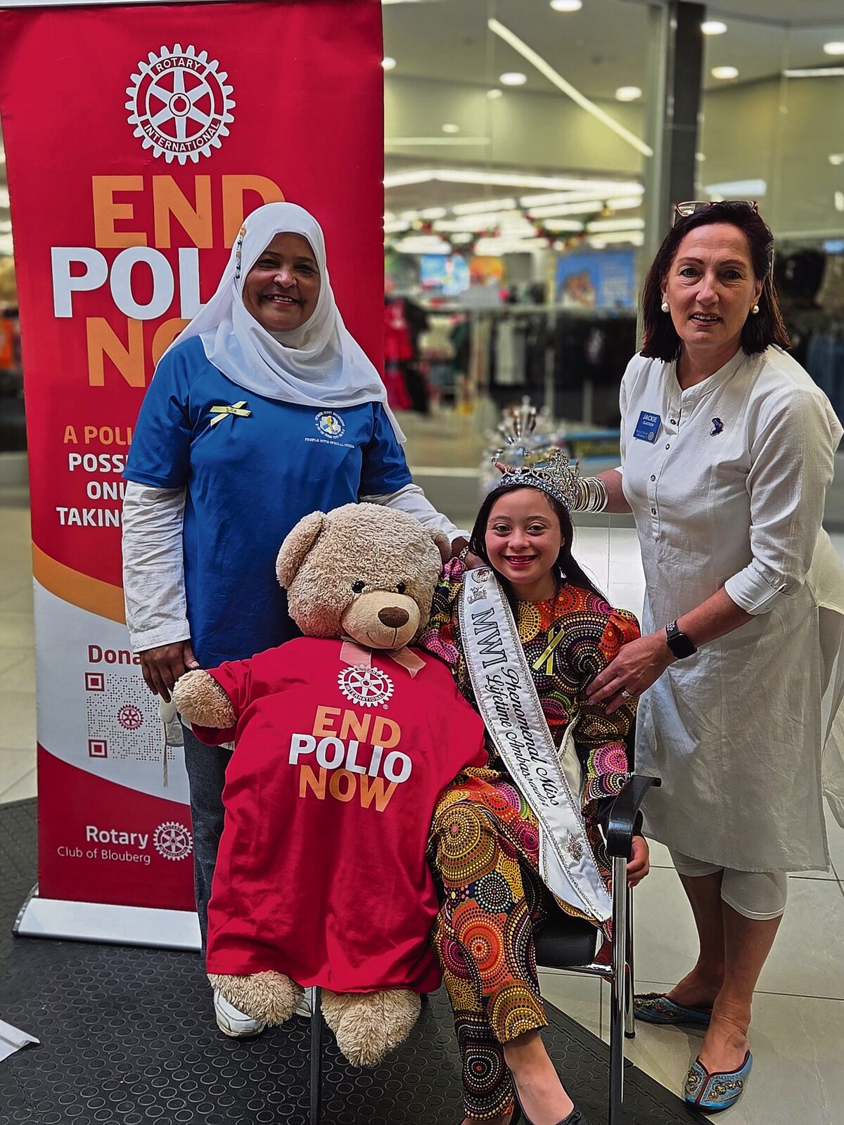 Down syndrome ambassador Shuneez Scott with her mother Bahia and Pres Jackie Claydon.