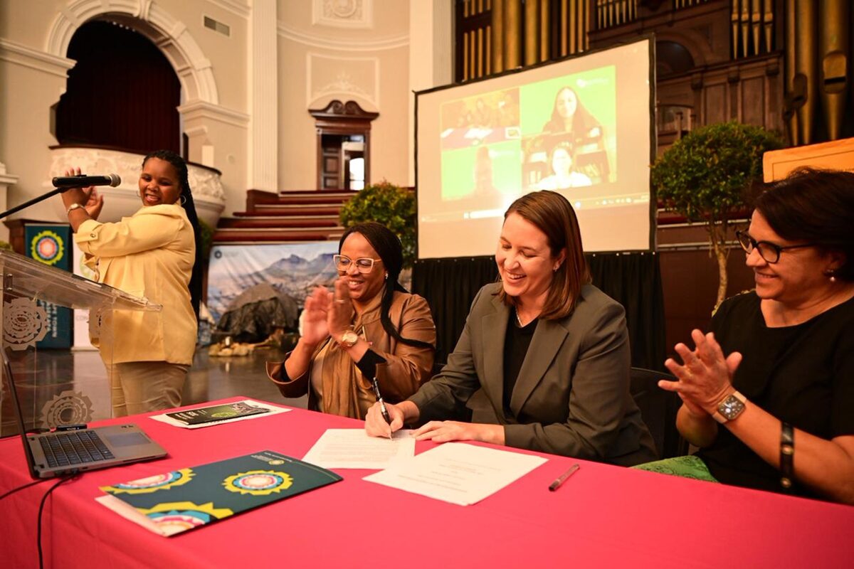 Francine Higham signs the formal agreement with the Institute for Global Homelessness.