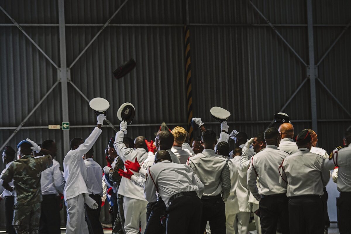 New CWDM firefighters celebrate their graduation with a proud cap toss into the sky.