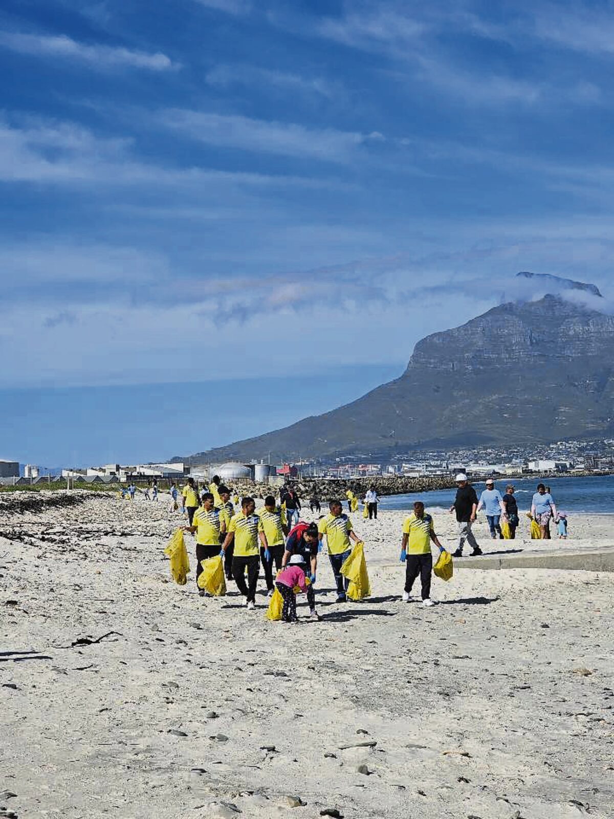 Volunteers roll up their sleeves to clean Lagoon Beach.