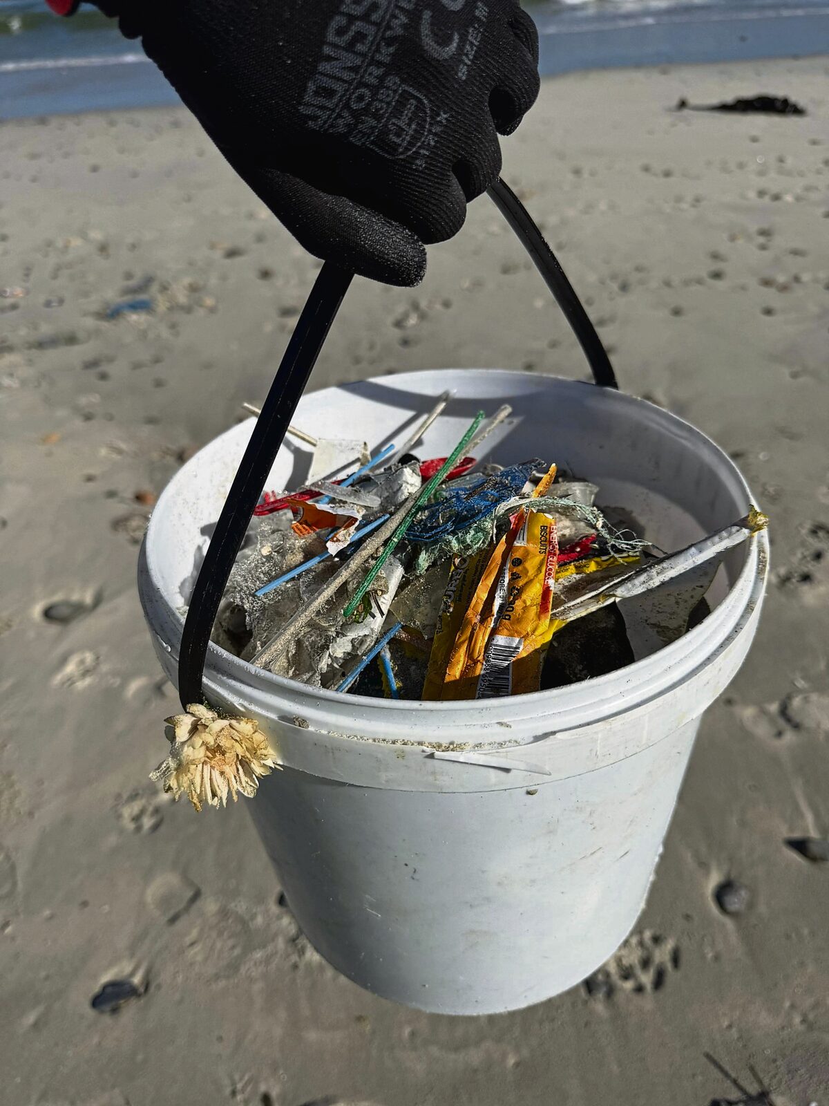 
A bucket filled with lollipop sticks.