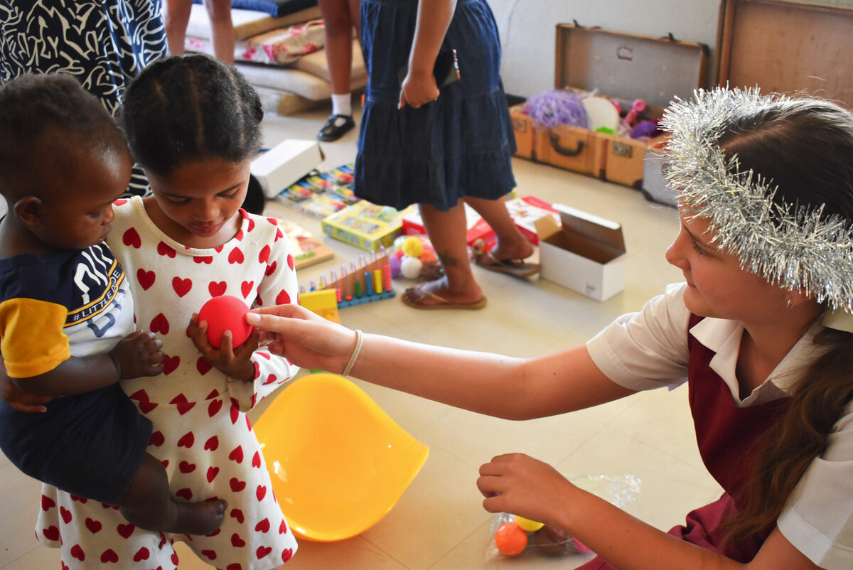 Foto van leerder en kinders