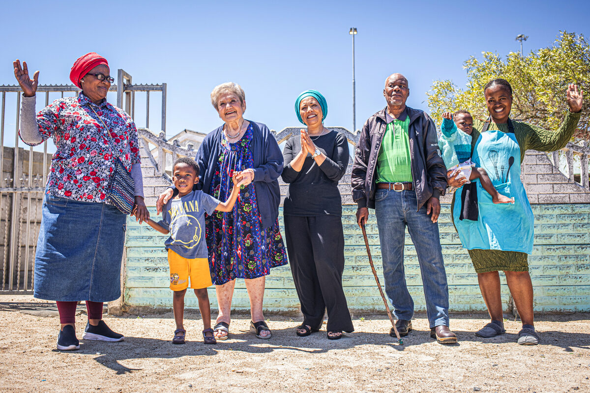 From left are Boniswa Mercy Retyu (senior club), Joshua Meintjies (learner), Helen Lieberman (founder), Ishrene Davids (director), Dalintetho Matiwane (senior club), Yamihle Daraza (baby who attends Ikamva Labantu's preschool), Ntombozuko Katangana (ECD) practitioner.